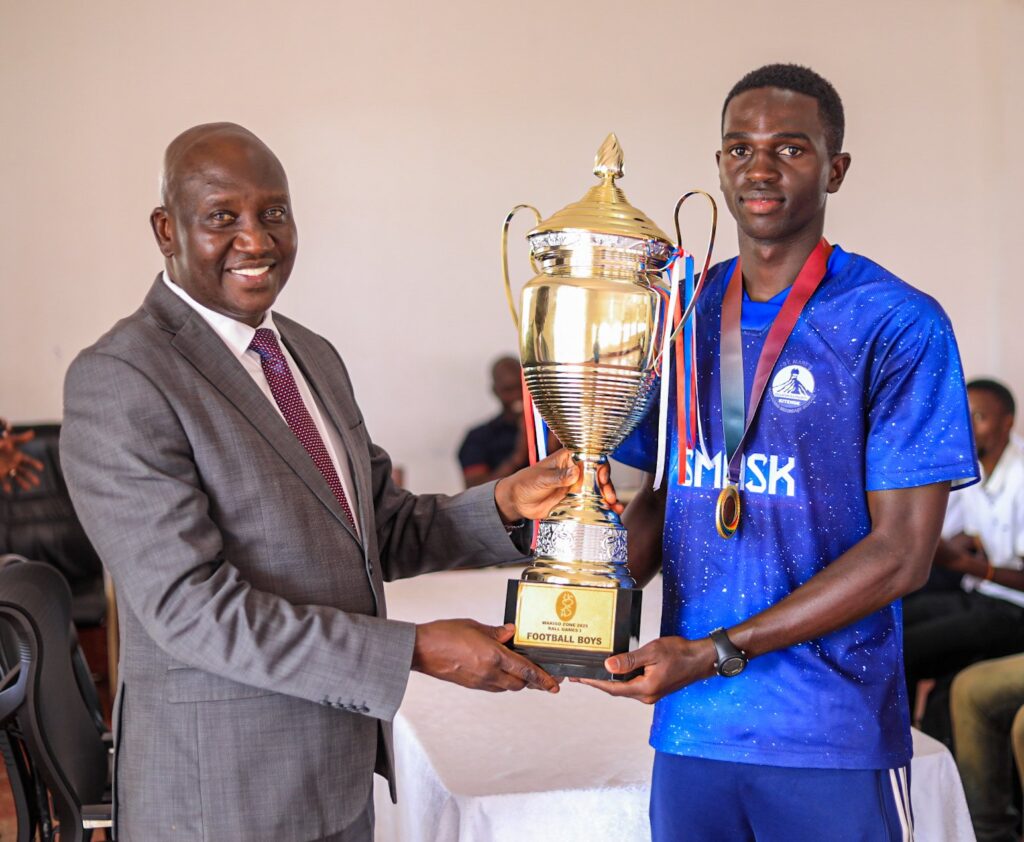 Dr. Mulindwa receives Wakiso district football trophy